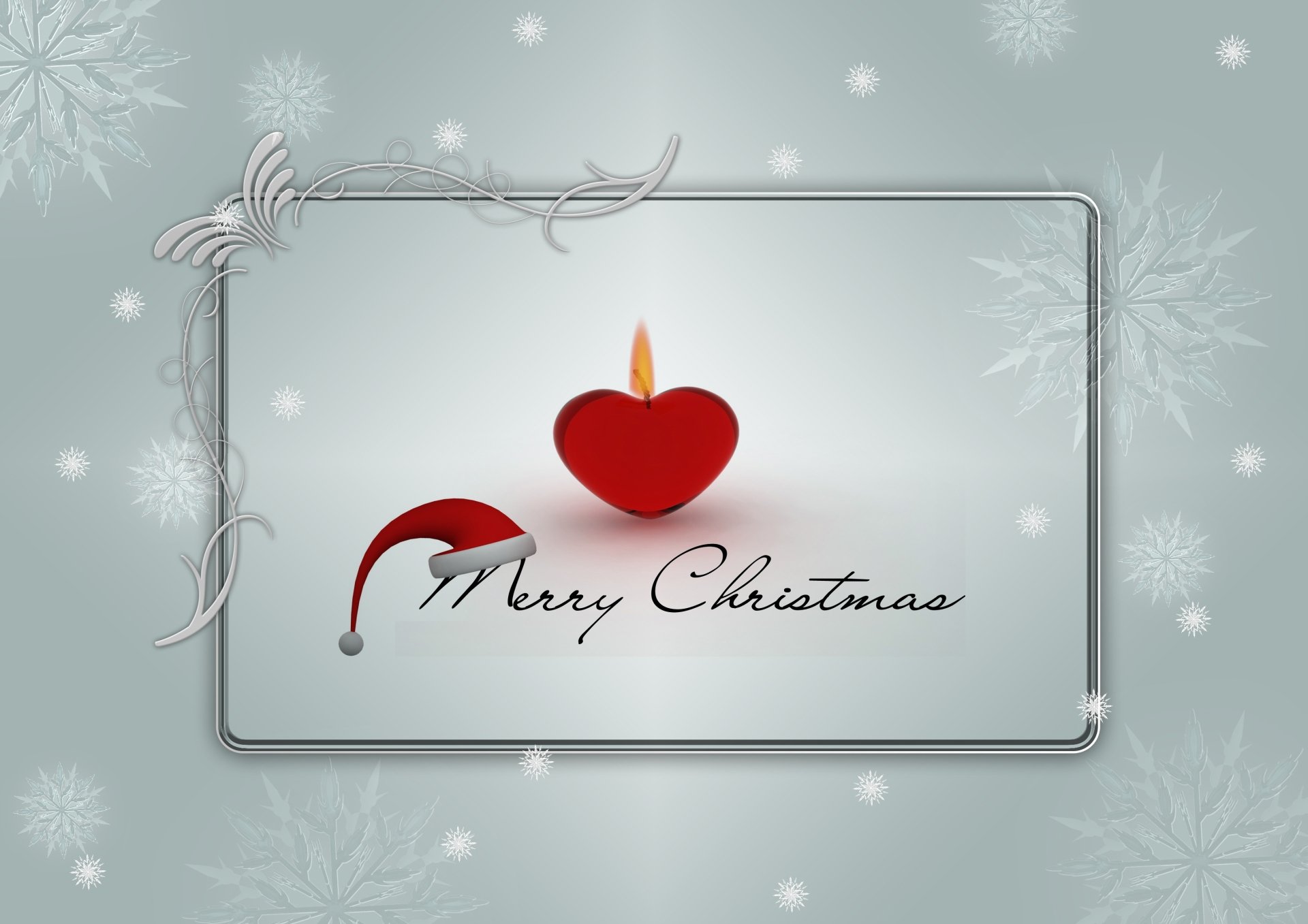 HD Christmas desktop wallpaper featuring a silver frame, delicate snowflakes, a red heart-shaped candle, and Merry Christmas text for a festive holiday card look.