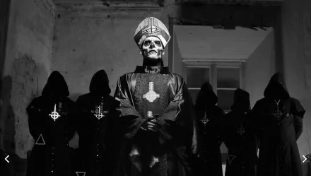 Black and white HD wallpaper featuring Ghost B.C., a heavy metal band, with members in dark, ritualistic attire standing in a dimly lit room.