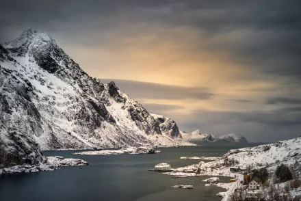 HD desktop wallpaper of a peaceful Lofoten landscape featuring snow-covered mountains beside serene waters. Perfect photography capturing the beauty of Lofoten.