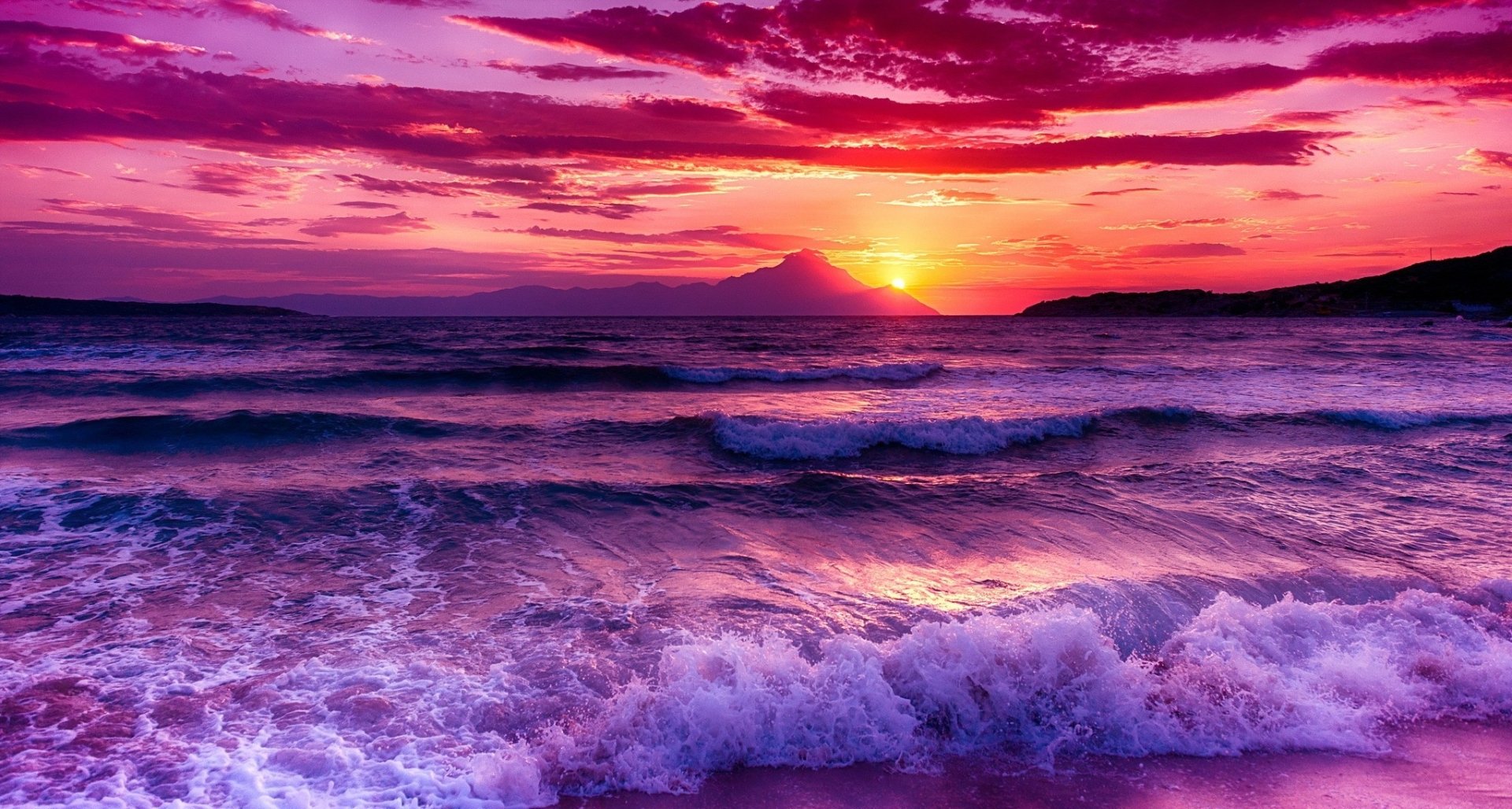 HD PC desktop wallpaper background: vivid magenta sunset sky over the ocean, rolling ocean waves and surf on the sea, tranquil nature scene.