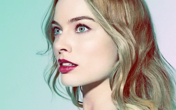 HD desktop wallpaper of Australian actress Margot Robbie with blonde hair, blue eyes, and red lipstick, showcasing a close-up of her face with a soft, colorful background.