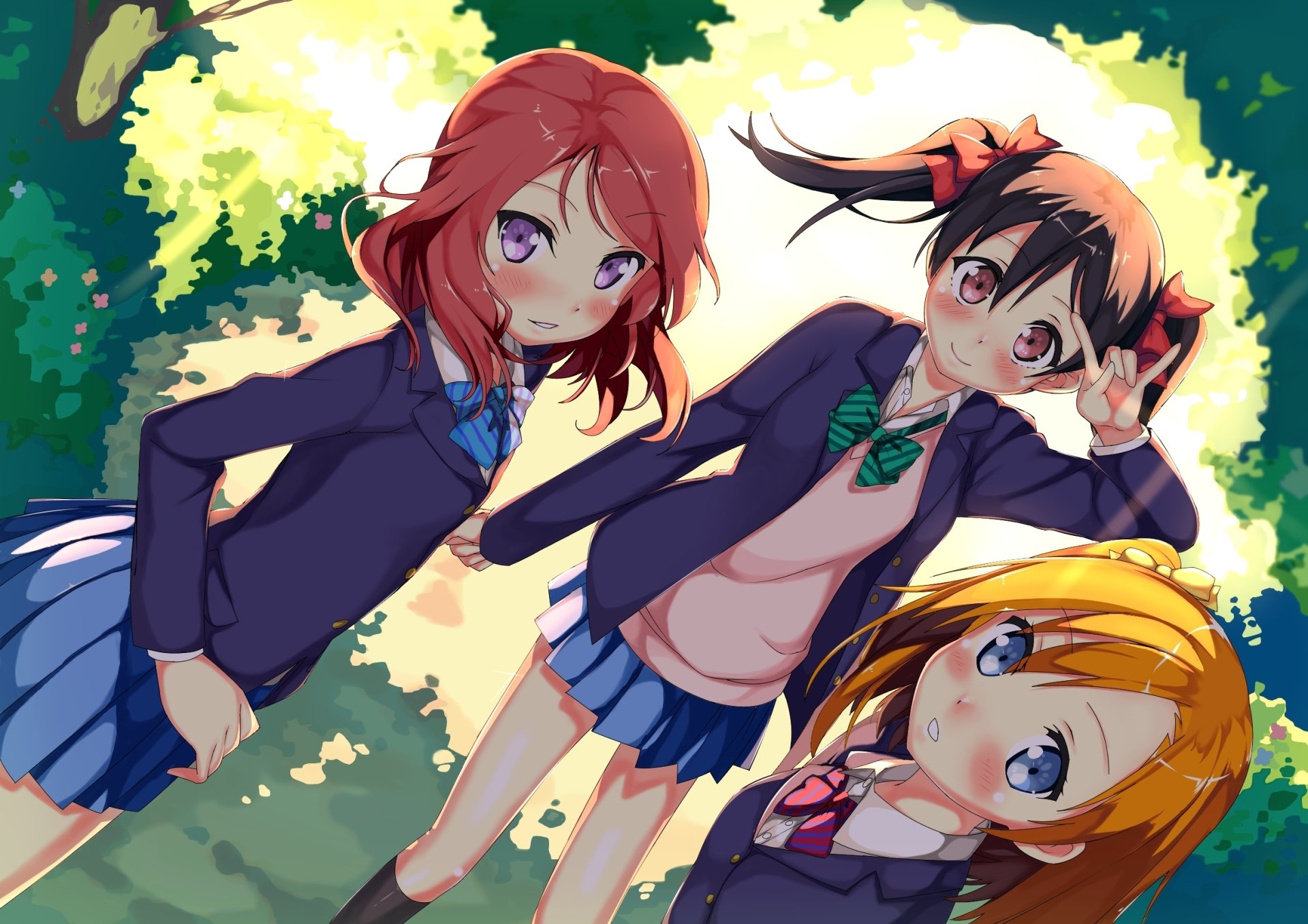 HD anime desktop wallpaper featuring Nico Yazawa, Maki Nishikino, and Honoka Kousaka from Love Live!, shown in school uniforms against a sunlit forest background.