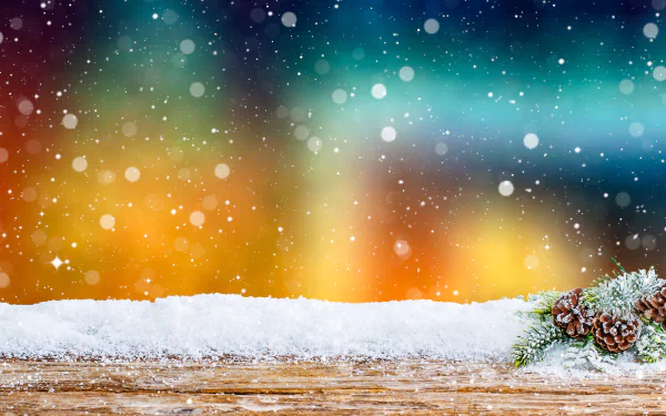 Nature, snowflake 4K Ultra HD PC desktop wallpaper: snowy wooden ledge with frosted pinecones and falling snowflakes against a colorful bokeh/aurora background.