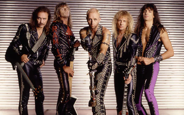 HD desktop wallpaper featuring Judas Priest, the iconic heavy metal band, posing in leather and studs against a metallic backdrop, embodying classic heavy metal style.