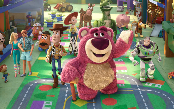 HD PC desktop wallpaper of Toy Story 3: Lots-o'-Huggin' Bear waving center stage with Woody, Buzz and the rest of the toy gang in a colorful daycare playroom.