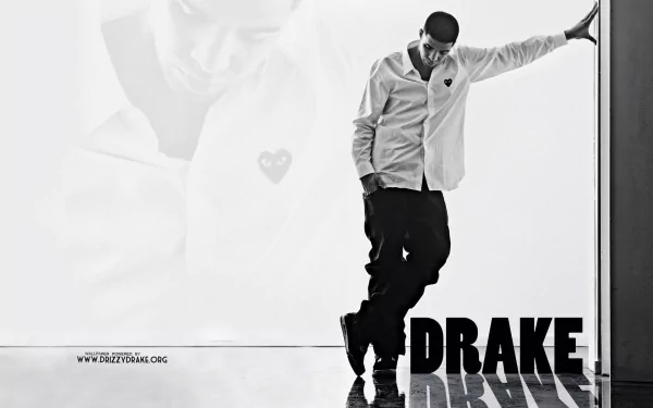 HD desktop wallpaper featuring a monochrome image of the artist Drake in a thoughtful pose with a heart symbol in the background.