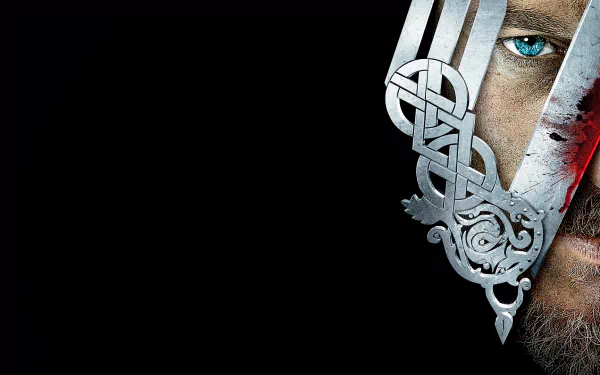 HD desktop wallpaper featuring a striking image from the TV show Vikings (2013), showcasing intricate design elements and a close-up of a character's face against a dark backdrop.