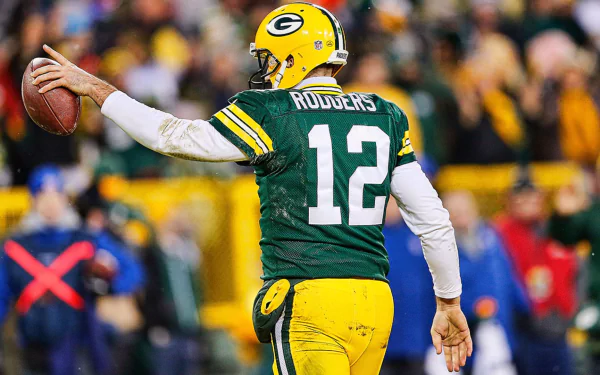 HD desktop wallpaper featuring Green Bay Packers quarterback #12 in mid-throw on the field, capturing the action of the game.
