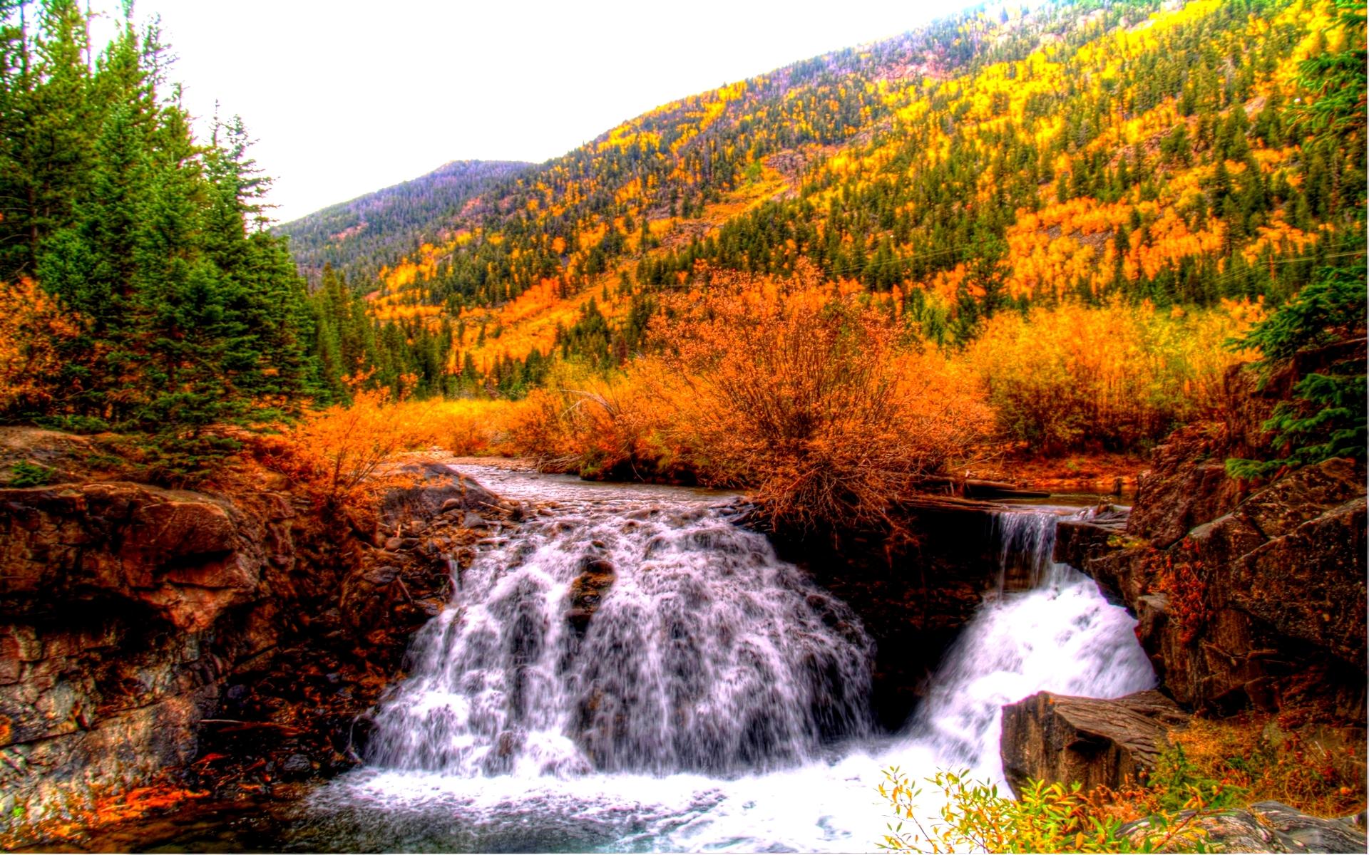 Waterfall in Autumn Mountains