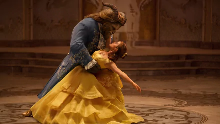 Emma Watson and Dan Stevens dancing in a scene from the 2017 movie Beauty and the Beast. This HD wallpaper showcases the characters Belle and the Beast in an elegant ballroom setting.