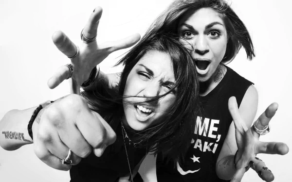 Black and white 4K Ultra HD PC wallpaper featuring the electronic music duo Krewella with dynamic, energetic expressions and hand gestures.
