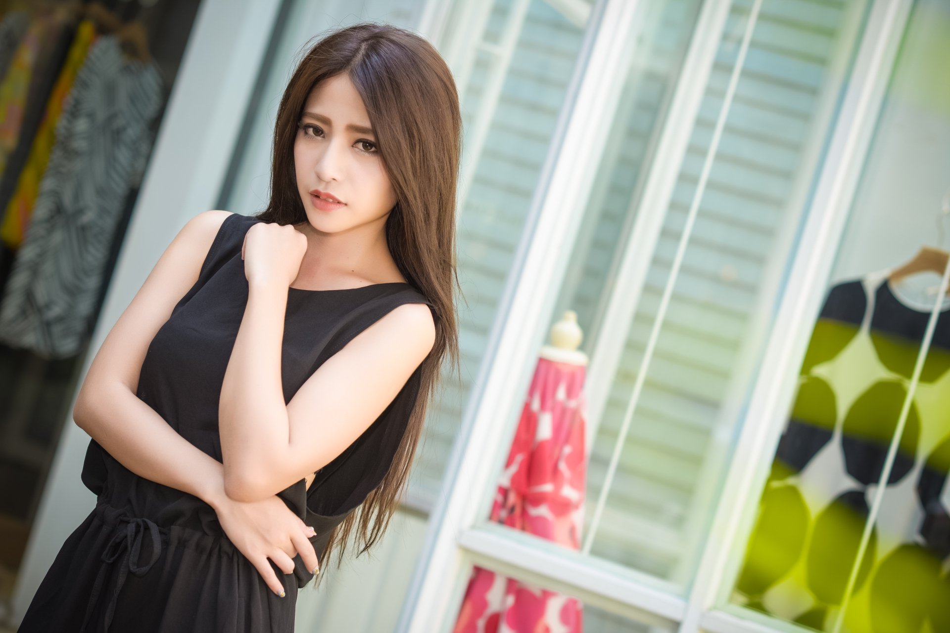 Asian woman with brown eyes and brunette hair wearing a black dress poses confidently indoors, captured in high definition for a PC desktop wallpaper.