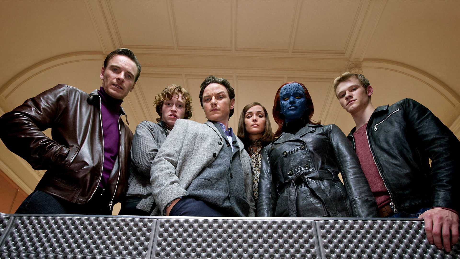 HD PC desktop wallpaper and background from the movie X-Men: First Class showing six characters, including a blue-skinned woman in leather, standing in formation and looking down at the viewer.