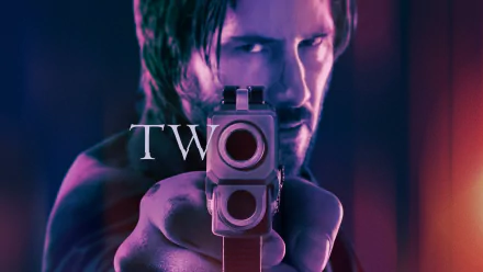 HD wallpaper featuring Keanu Reeves as John Wick from John Wick: Chapter 2, holding a gun with an intense look, set against a dramatic background. The numeral TWO is overlaid on the image.