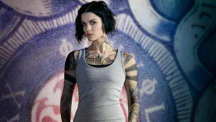 HD desktop wallpaper featuring Jaimie Alexander with short hair and tattoos, styled as her character from the TV show Blindspot.