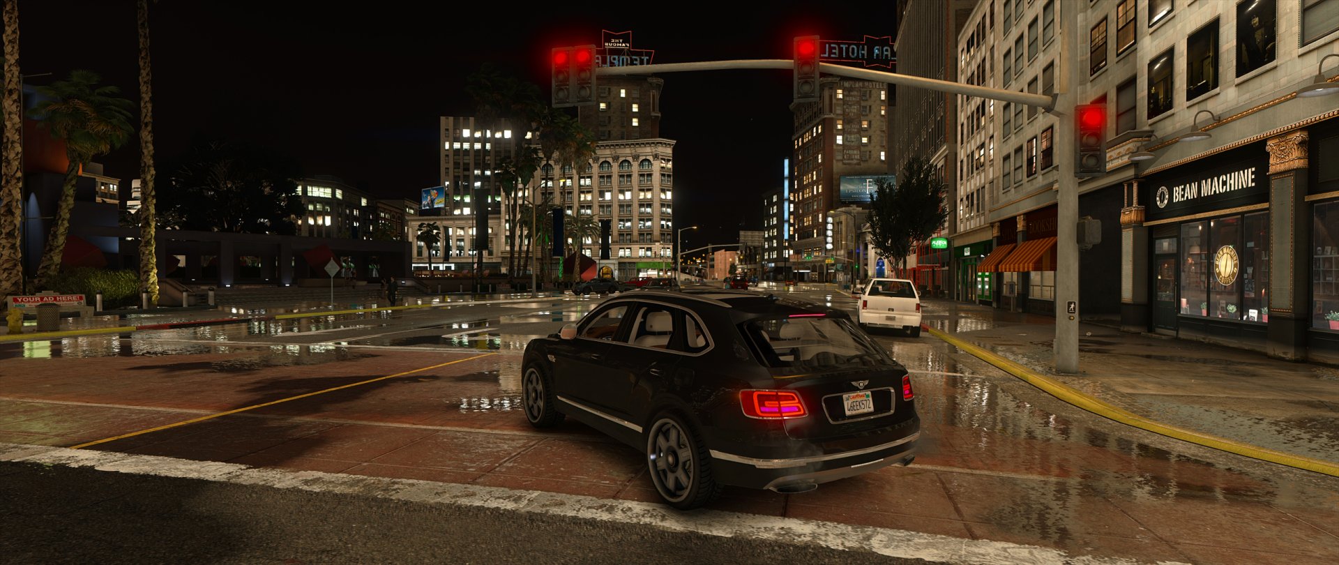 HD PC desktop wallpaper featuring a nighttime city street scene from the video game Grand Theft Auto V, showcasing detailed buildings, cars, and wet pavement reflections.