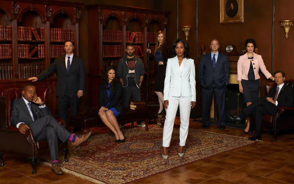 HD PC desktop wallpaper and background featuring the Scandal TV show cast posed in a wood-paneled library, central figure in a white suit with ensemble in formal attire.