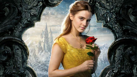 HD desktop wallpaper of Emma Watson as Belle holding a red rose from Beauty and the Beast (2017), with an enchanted castle in the background.