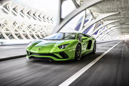 A vibrant green Lamborghini Aventador S supercar speeding through a futuristic urban tunnel, captured in stunning 4K Ultra HD as a dynamic PC desktop wallpaper.