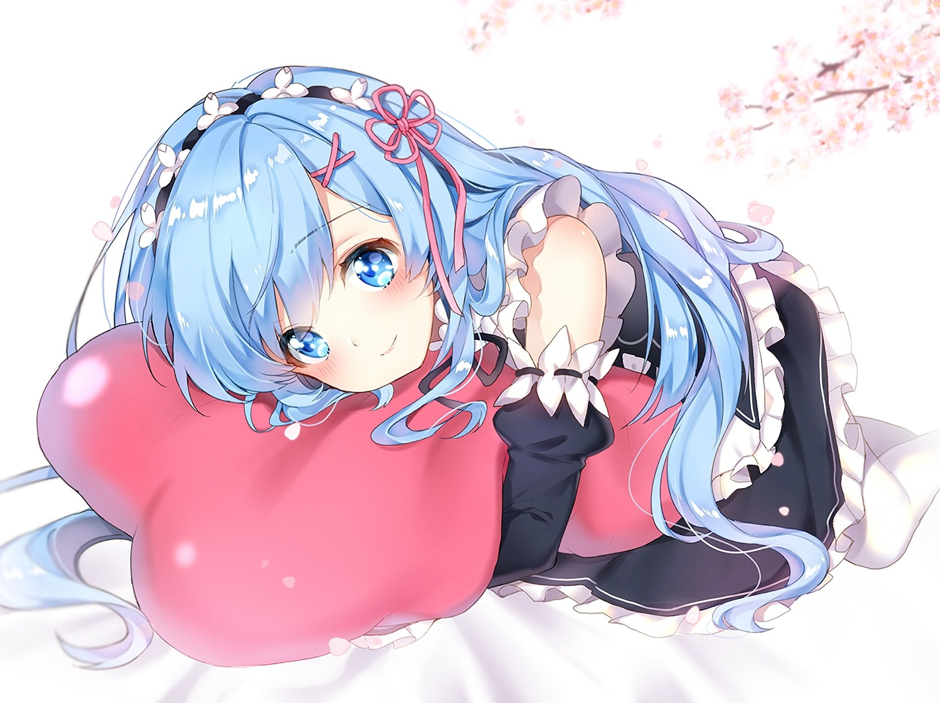 HD desktop wallpaper featuring Rem from Re:Zero - Starting Life in Another World, with blue hair and a maid outfit, lying on a pink heart-shaped cushion amidst soft cherry blossom petals.