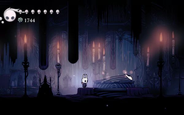 4K Ultra HD Hollow Knight video game wallpaper featuring the main character in a dark, candlelit underground setting with intricate gothic details.