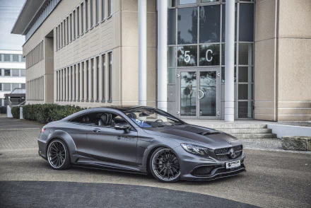 Silver Mercedes-Benz S-Class coupe parked in front of a modern building, captured in high definition as a PC desktop wallpaper and background.