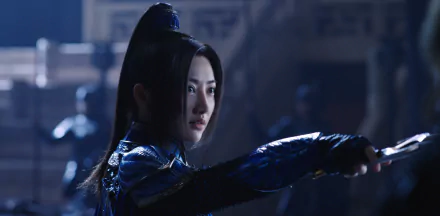 HD desktop wallpaper featuring Jing Tian from the movie The Great Wall in a battle-ready stance, dressed in blue armor.