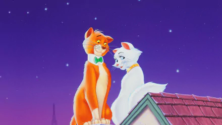 HD PC desktop wallpaper background from the movie The Aristocats: an orange male cat with a green bow tie and a white cat sit on a rooftop, gazing under a starry purple sky with the Eiffel Tower silhouette.