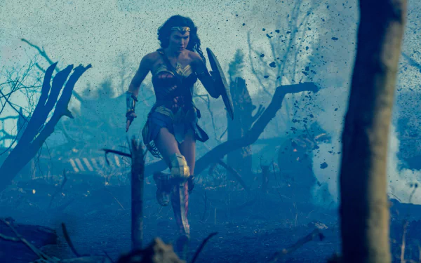 Wonder Woman, portrayed by Gal Gadot, bravely charges through a war-torn battlefield. This HD desktop wallpaper captures a dynamic scene from the movie, set against a backdrop of chaos and destruction.