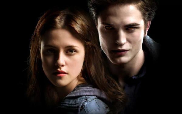 HD wallpaper featuring Kristen Stewart as Bella Swan and Robert Pattinson as Edward Cullen from the movie Twilight. Dark background with the characters closely positioned, emphasizing their expressions.