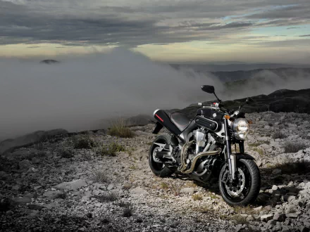 YAMAHA MT-01 motorcycle on a rocky ridge under dramatic clouds — vehicle in a 4K Ultra HD PC desktop wallpaper/background.