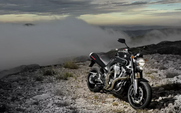 YAMAHA MT-01 motorcycle on a rocky ridge under dramatic clouds — vehicle in a 4K Ultra HD PC desktop wallpaper/background.