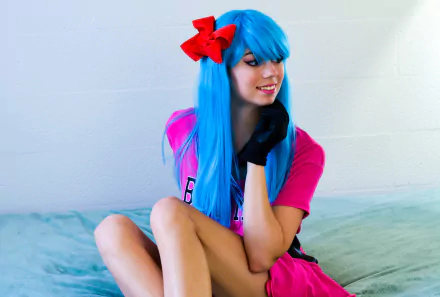 Uncanny Megan cosplays as Bulma from Dragon Ball, featuring vibrant blue hair with a red bow and a pink outfit, captured in 4K Ultra HD for PC desktop wallpaper.