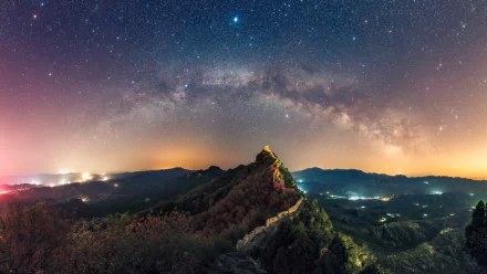 A breathtaking panorama of the Great Wall of China under a starry night sky. This HD desktop wallpaper captures the beauty of nature seamlessly merging with man-made marvels.
