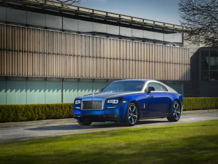 A blue Rolls-Royce Wraith car parked outdoors against a modern building, captured in 4K Ultra HD for a PC desktop wallpaper background.