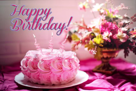 HD desktop wallpaper of a festive birthday scene with a pink rose-decorated cake and Happy Birthday! text, set against a background featuring a vibrant floral arrangement.
