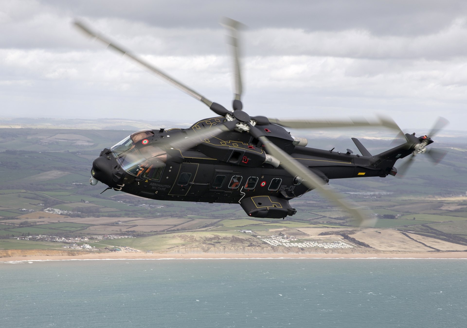 AgustaWestland AW101 military helicopter flying over a coastline, rendered as a high-resolution 5K Ultra HD PC desktop wallpaper background.