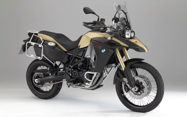 A BMW F800GS Adventure bike in beige and black, showcased as a 4K Ultra HD PC desktop wallpaper background.