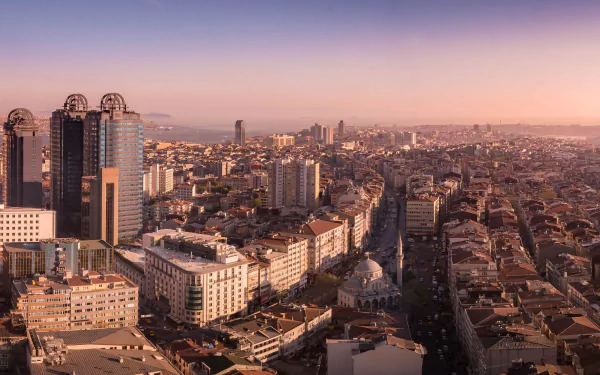 A 4K Ultra HD view of Istanbul, Turkey, showcasing the city's dense architecture, skyscrapers, and urban buildings at sunset.