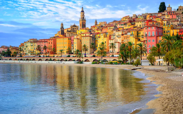 4K Ultra HD view of the French Riviera town with colorful architecture along a peaceful beach, showcasing the charm of this man-made coastal destination.
