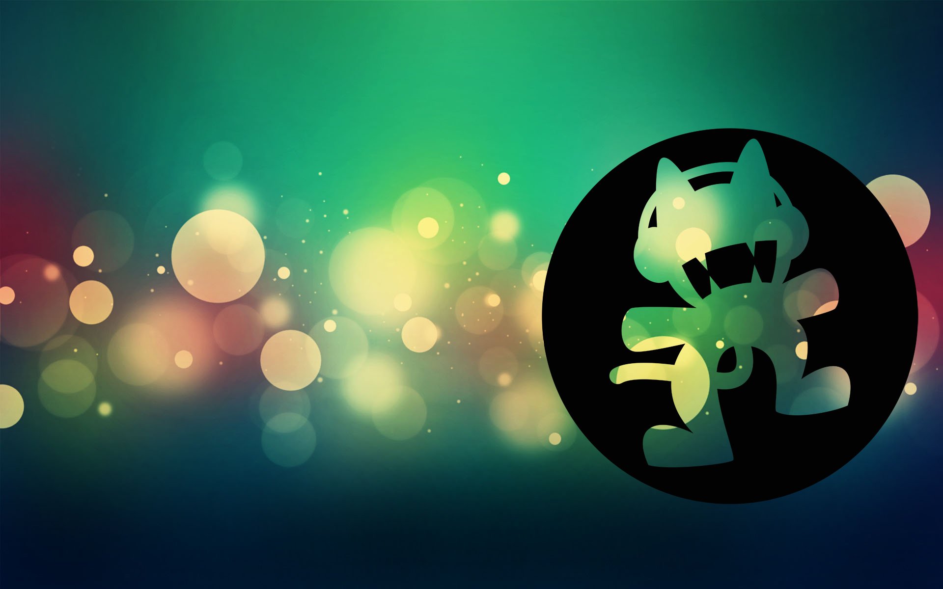 HD desktop wallpaper featuring the Monstercat logo with a colorful bokeh background.