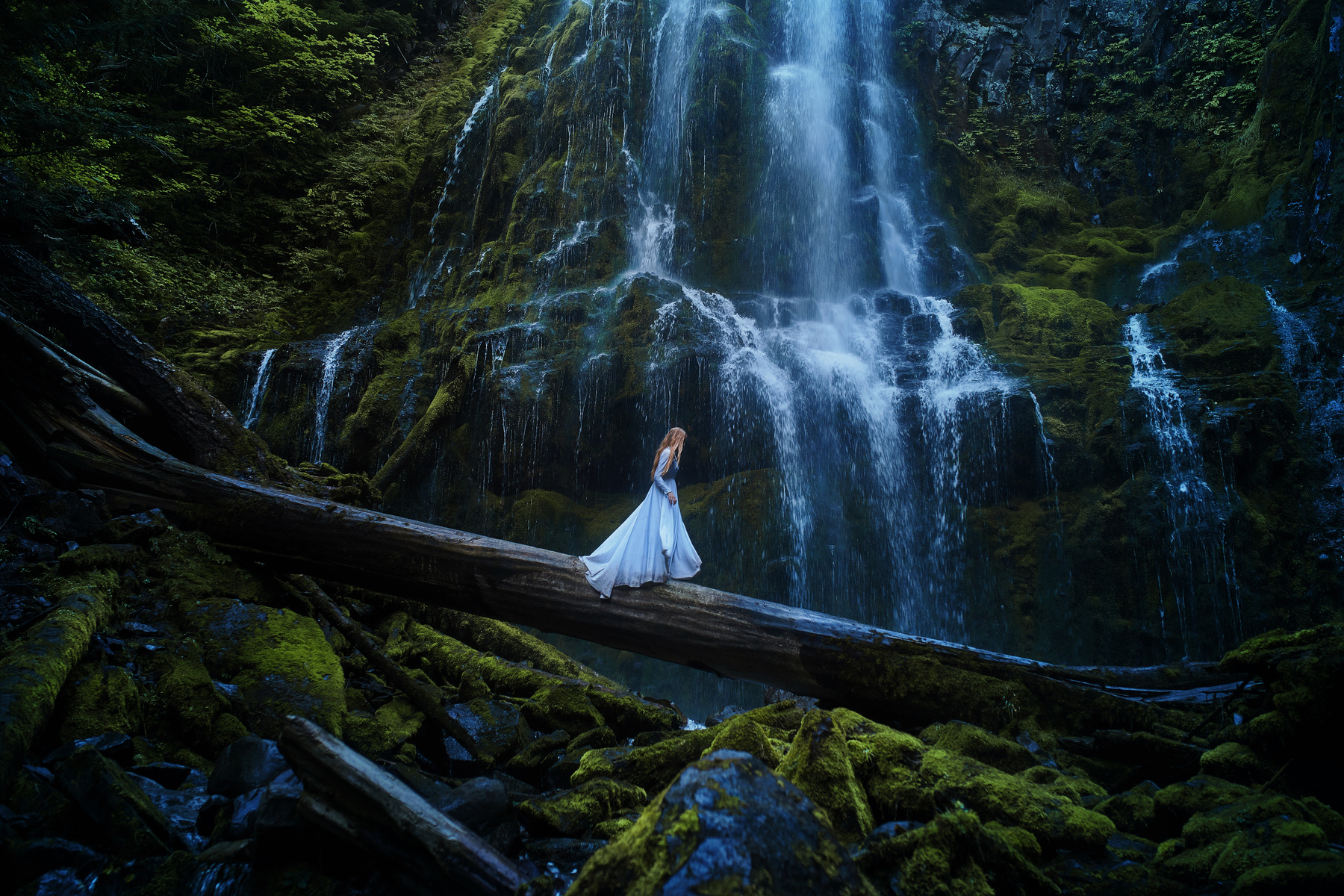 Girl at Cascading Waterfall by TJ Drysdale