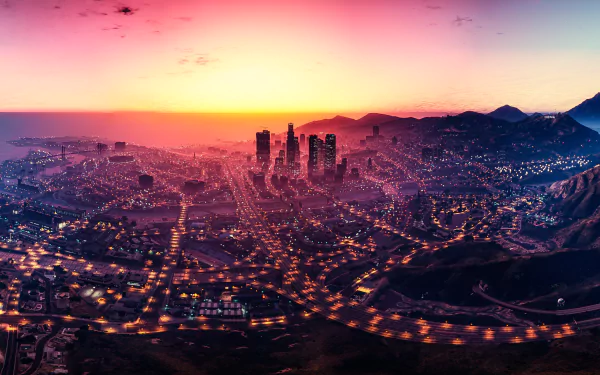 HD desktop wallpaper featuring a stunning sunset sky over the fictional city of Los Santos from the video game Grand Theft Auto V, showcasing the skyline and city lights.