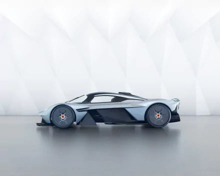 HD desktop wallpaper featuring a sleek Aston Martin Valkyrie supercar in a modern, minimalistic setting.