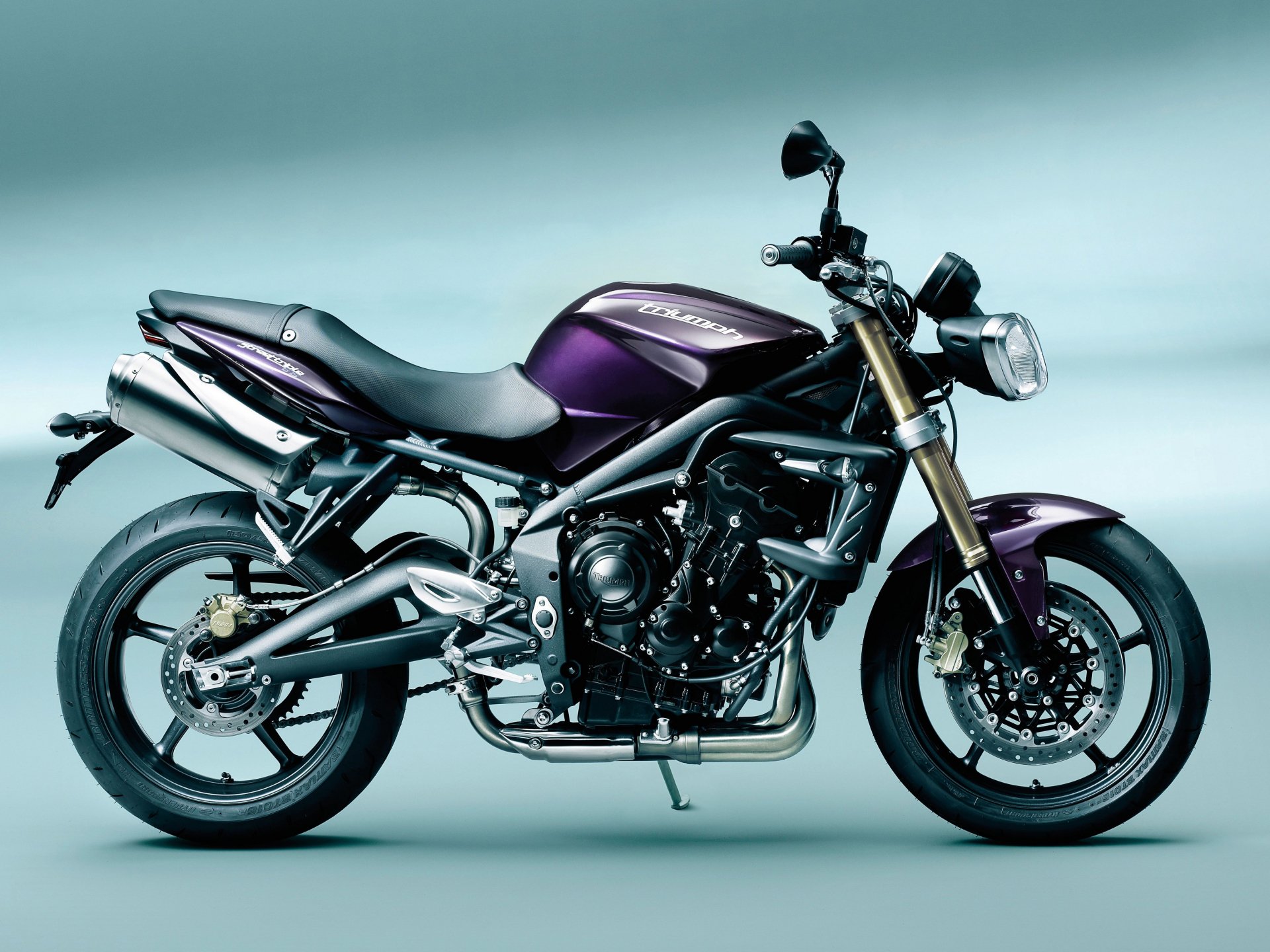 Side view of a purple Triumph Street Triple motorcycle — a sport naked vehicle on a minimalist gradient, 4K Ultra HD PC desktop wallpaper and background.