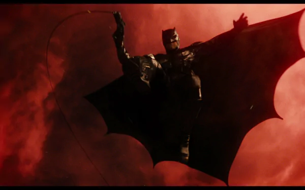 Ben Affleck as Batman in a dramatic red-hued scene from the 2017 Justice League movie, featured as an HD PC desktop wallpaper.