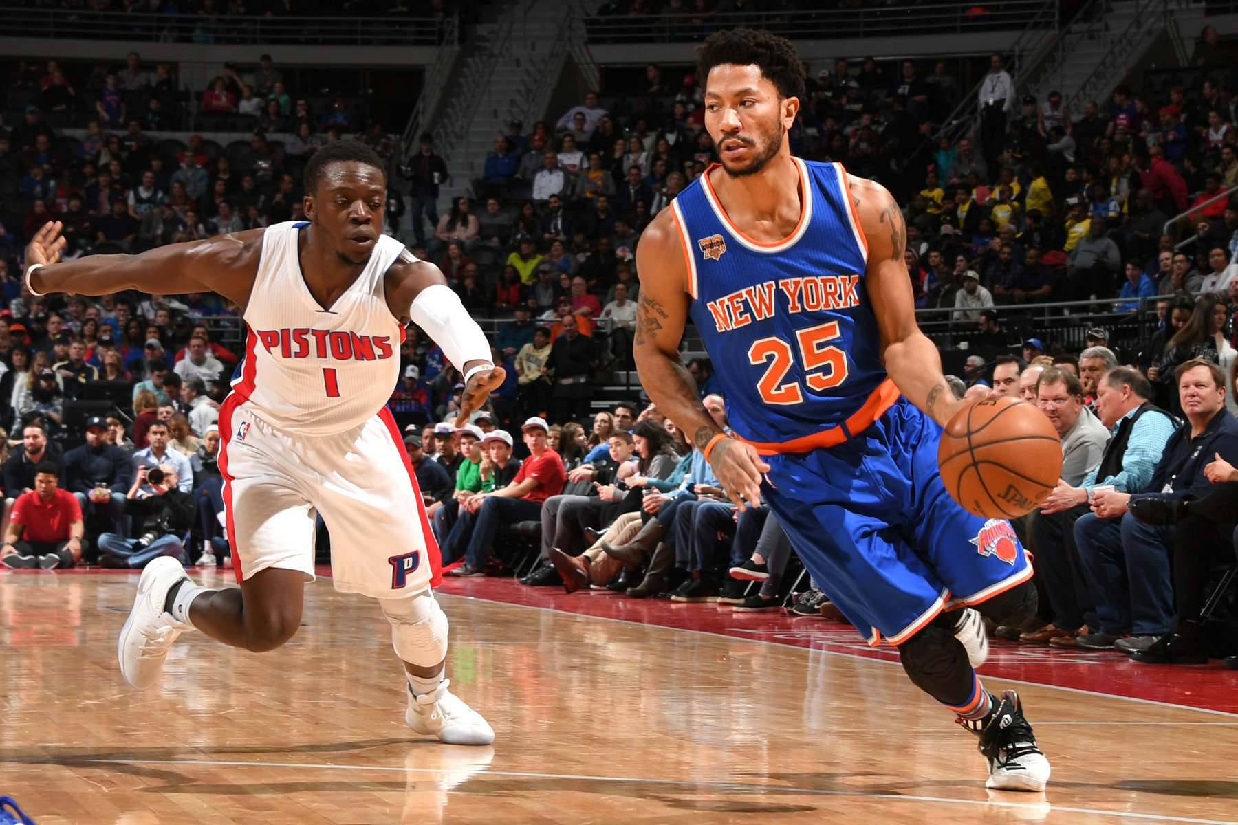 HD desktop wallpaper featuring Derrick Rose in a New York Knicks jersey dribbling past a Detroit Pistons player during a basketball game.