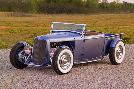 Vintage blue Ford Roadster Pickup hot rod parked on gravel, showcased as a high-definition PC desktop wallpaper and background.