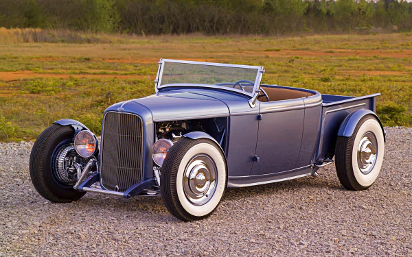 Vintage blue Ford Roadster Pickup hot rod parked on gravel, showcased as a high-definition PC desktop wallpaper and background.