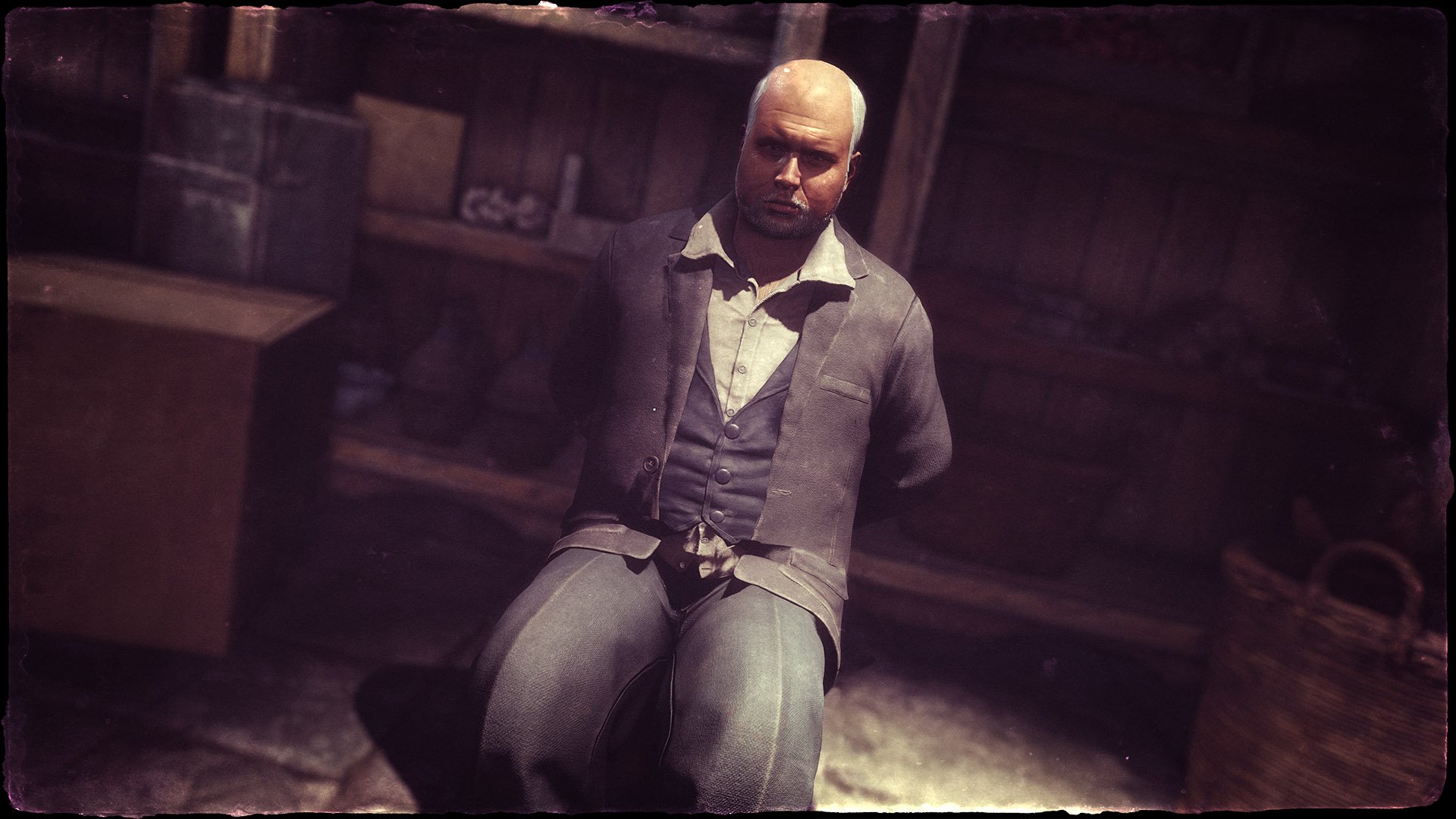 HD PC desktop wallpaper from the video game Sniper Elite 4, showing a tied man in a dimly lit indoor setting.